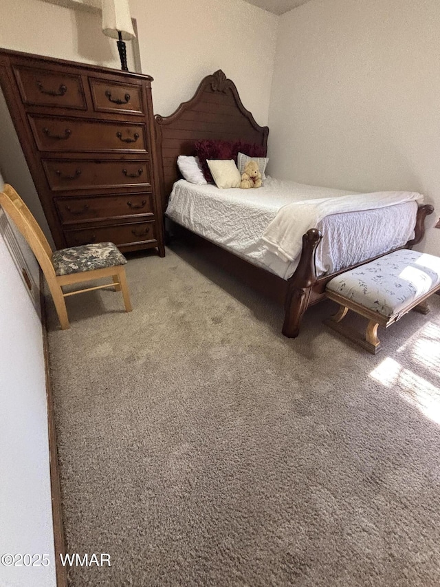 bedroom with light colored carpet