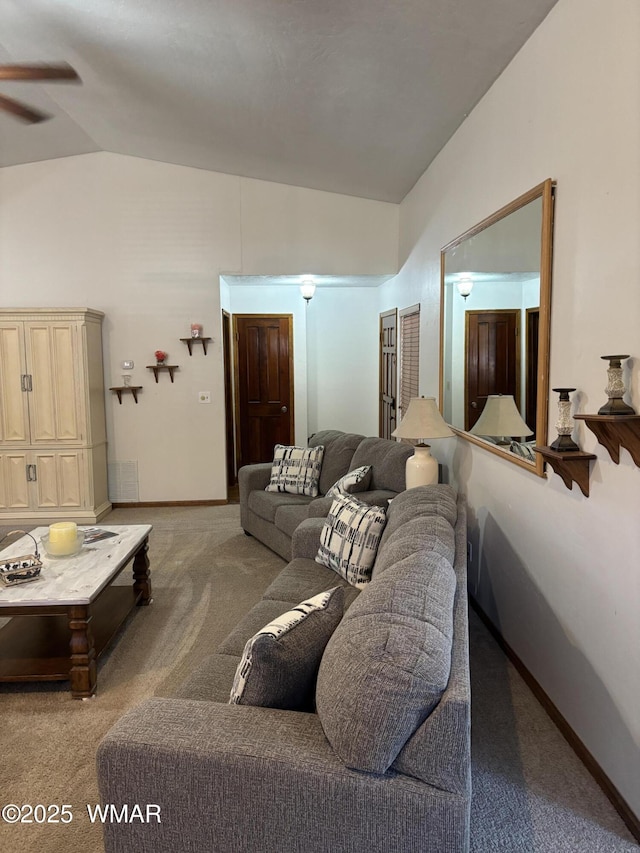 carpeted living room featuring visible vents, baseboards, and high vaulted ceiling