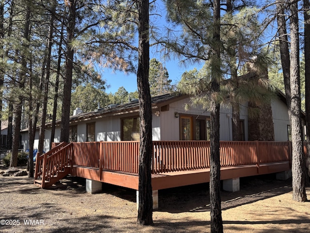 rear view of house with a wooden deck