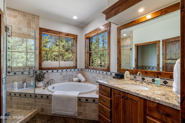 3 County Road 1058, Greer, AZ 85927 - bathroom featuring vanity, a bath, a shower stall, and recessed lighting