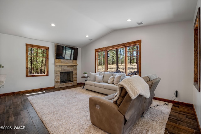 3 County Road 1058, Greer, AZ 85927 - living room featuring plenty of natural light, dark wood-style flooring, vaulted ceiling, recessed lighting, and a stone fireplace