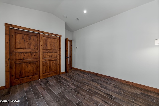 3 County Road 1058, Greer, AZ 85927 - unfurnished bedroom with wood tiled floors, lofted ceiling, baseboards, and recessed lighting