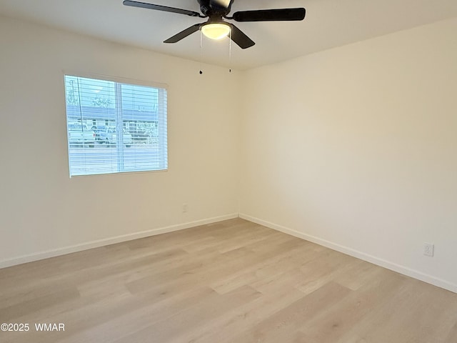 412 W 8th St S, Snowflake, AZ 85937 - empty room featuring light wood-style flooring, baseboards, and ceiling fan