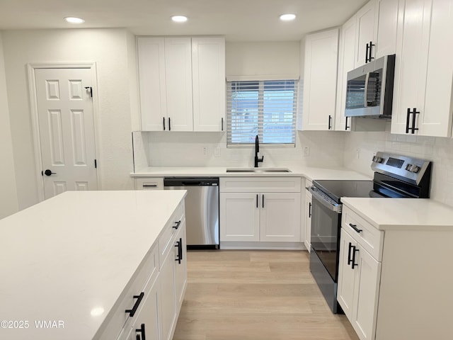 412 W 8th St S, Snowflake, AZ 85937 - kitchen with stainless steel appliances, a sink, white cabinets, decorative backsplash, and recessed lighting