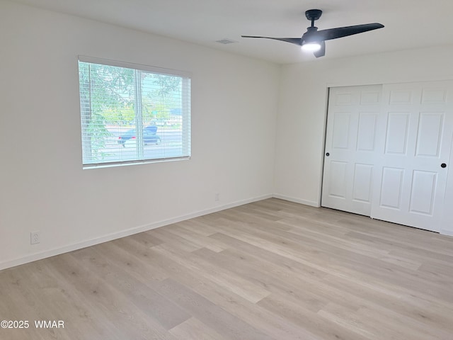 412 W 8th St S, Snowflake, AZ 85937 - unfurnished bedroom featuring light wood-style floors, a closet, baseboards, and ceiling fan