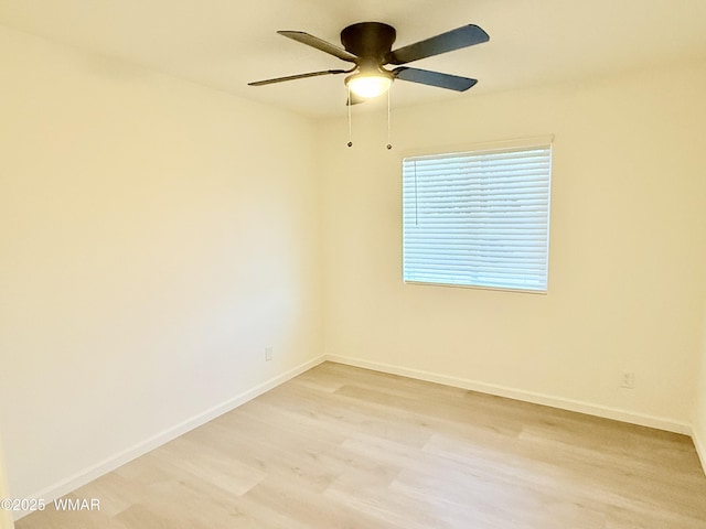 412 W 8th St S, Snowflake, AZ 85937 - unfurnished room with light wood-type flooring, a ceiling fan, and baseboards