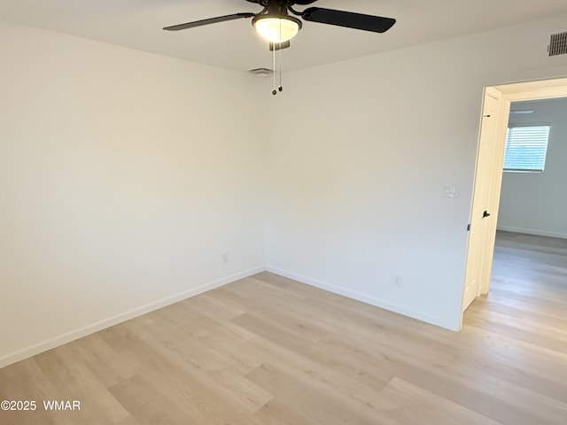 412 W 8th St S, Snowflake, AZ 85937 - empty room with a ceiling fan, light wood-style flooring, and baseboards