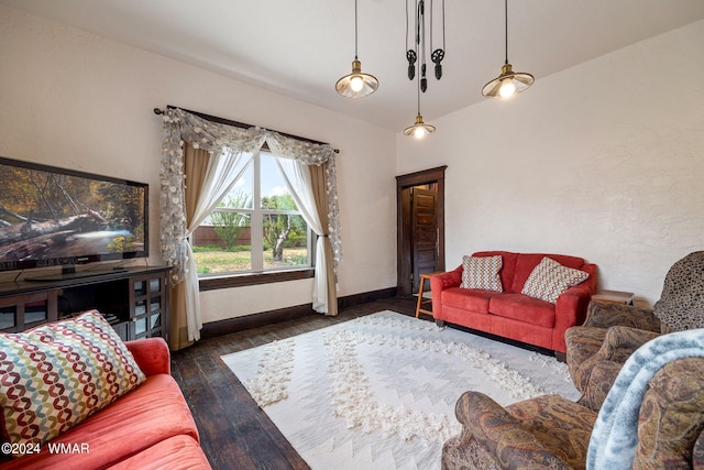 living area with dark wood-style floors and baseboards