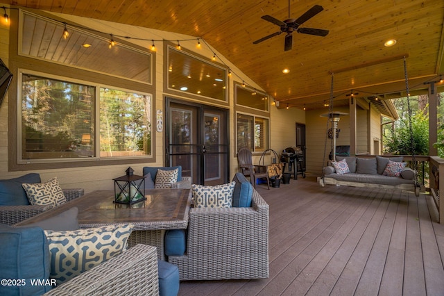 deck featuring an outdoor living space, outdoor dining area, and ceiling fan