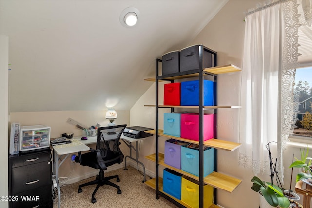 office area featuring vaulted ceiling and baseboards