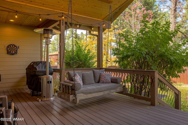 wooden deck with area for grilling