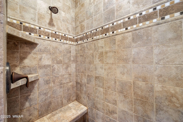 bathroom with a tile shower