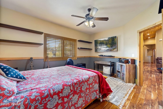 bedroom featuring wood finished floors and a ceiling fan