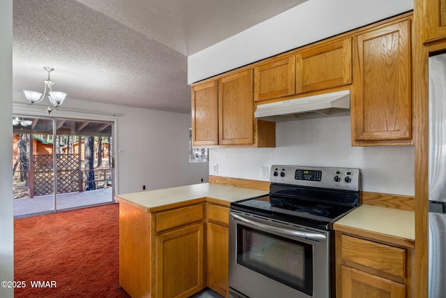 kitchen with a textured ceiling, under cabinet range hood, stainless steel appliances, a peninsula, and light countertops