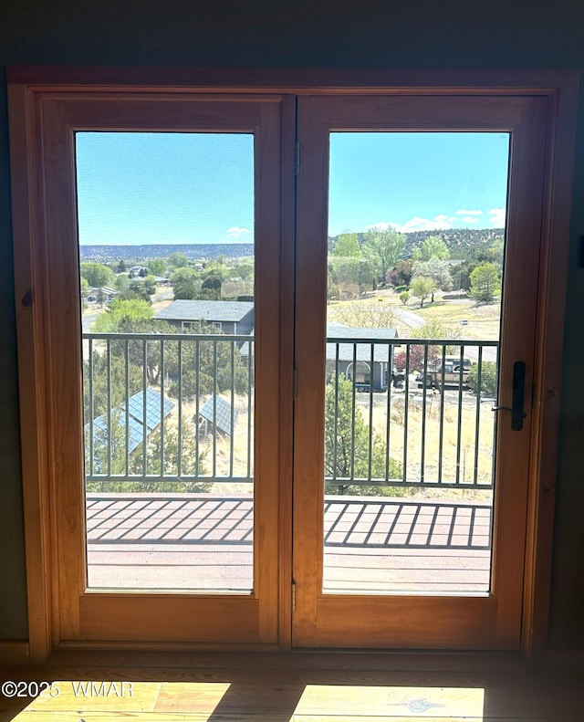822 E 1st Ln, Eagar, AZ 85925 - doorway to outside featuring plenty of natural light and wood finished floors