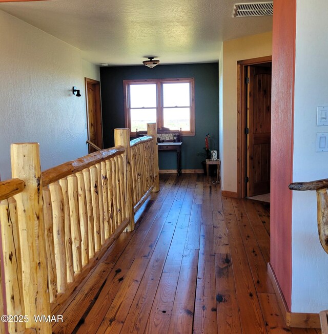 822 E 1st Ln, Eagar, AZ 85925 - hall with hardwood / wood-style flooring and baseboards