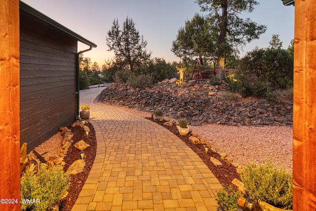 view of patio terrace at dusk