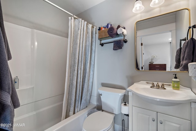 bathroom with toilet, shower / bathtub combination with curtain, and vanity