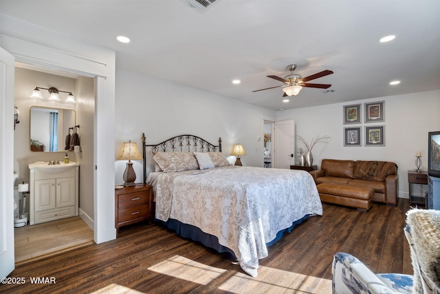 bedroom with visible vents, baseboards, dark wood-style flooring, and recessed lighting