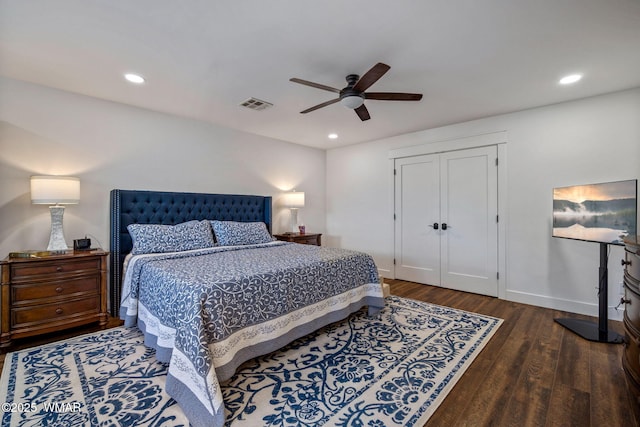 bedroom with dark wood-style floors, baseboards, visible vents, and recessed lighting