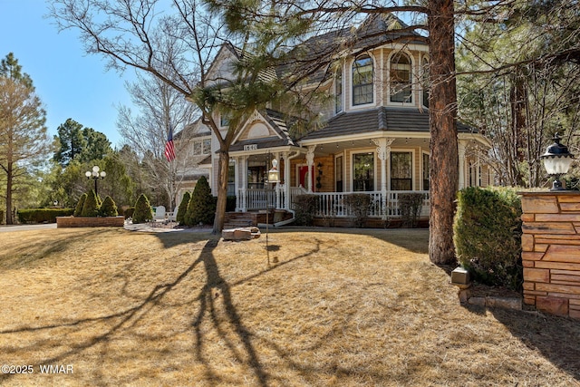 victorian house featuring a porch