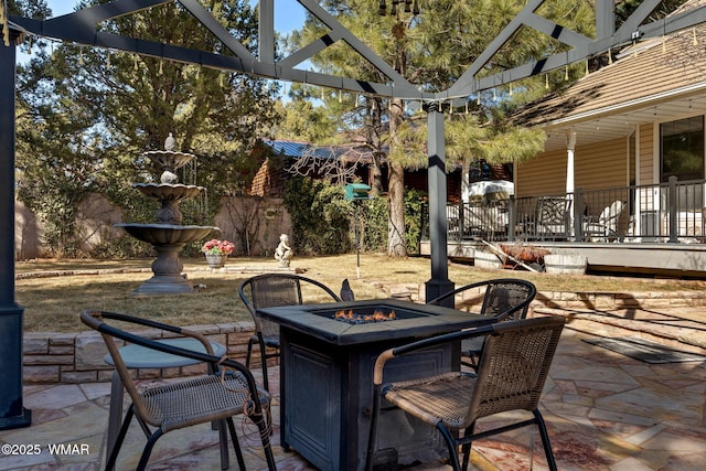 view of patio / terrace featuring a fire pit and a pergola