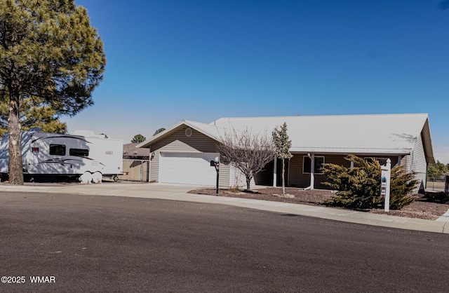 view of front facade featuring driveway and an attached garage