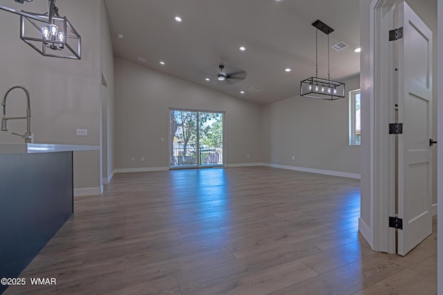 860 E Blue Jay Ln, Show Low, AZ 85901 - unfurnished dining area with light wood-style floors, recessed lighting, a ceiling fan, and high vaulted ceiling