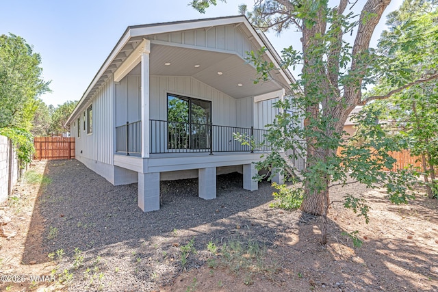 860 E Blue Jay Ln, Show Low, AZ 85901 - rear view of house featuring a fenced backyard and board and batten siding