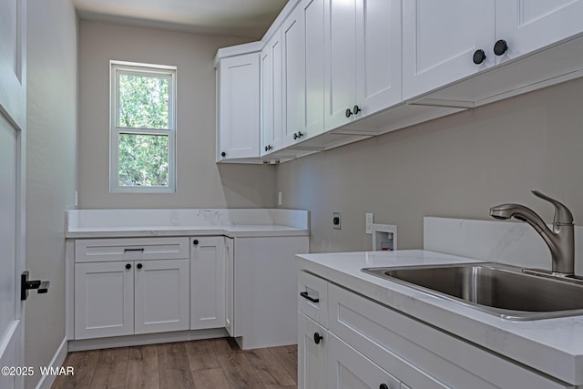 860 E Blue Jay Ln, Show Low, AZ 85901 - laundry area with cabinet space, hookup for a washing machine, electric dryer hookup, and wood finished floors