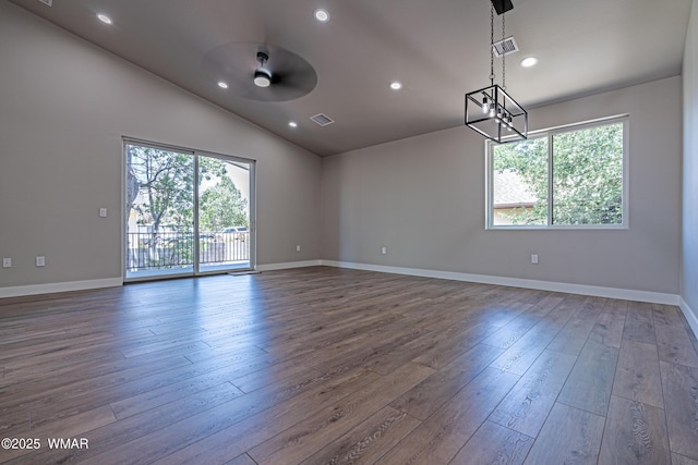 860 E Blue Jay Ln, Show Low, AZ 85901 - spare room featuring dark wood-style floors, lofted ceiling, ceiling fan, recessed lighting, and a chandelier