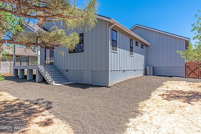 860 E Blue Jay Ln, Show Low, AZ 85901 - view of front of property with crawl space, board and batten siding, and stairway