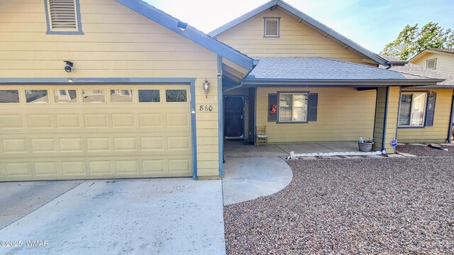 860 N Kiaya Ln, Show Low, AZ 85901 - view of front facade with roof with shingles, a garage, and driveway