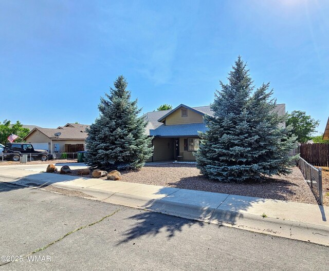 860 N Kiaya Ln, Show Low, AZ 85901 - view of property hidden behind natural elements featuring covered porch