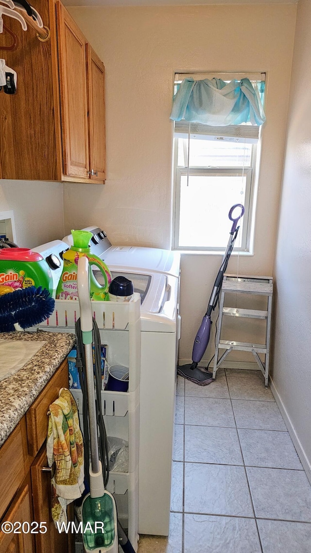 860 N Kiaya Ln, Show Low, AZ 85901 - laundry room featuring washing machine and clothes dryer, cabinet space, and light tile patterned floors