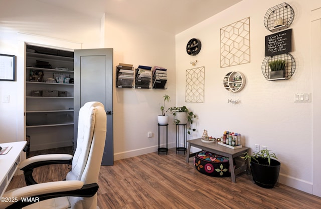 home office with baseboards and wood finished floors