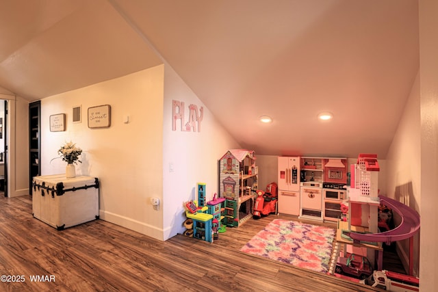 recreation room featuring recessed lighting, vaulted ceiling, baseboards, and wood finished floors