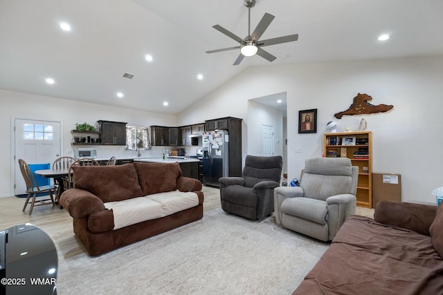 living room with a healthy amount of sunlight, recessed lighting, light wood-style floors, and ceiling fan
