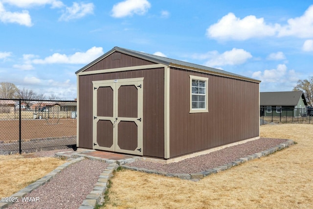 view of shed with fence