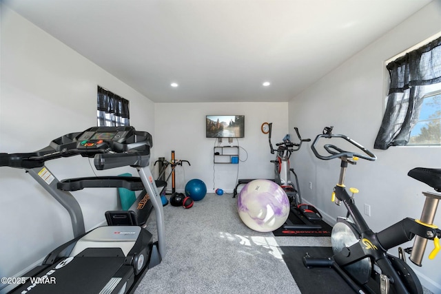 workout room featuring recessed lighting and baseboards