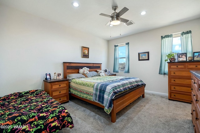 bedroom featuring recessed lighting, visible vents, light colored carpet, and baseboards