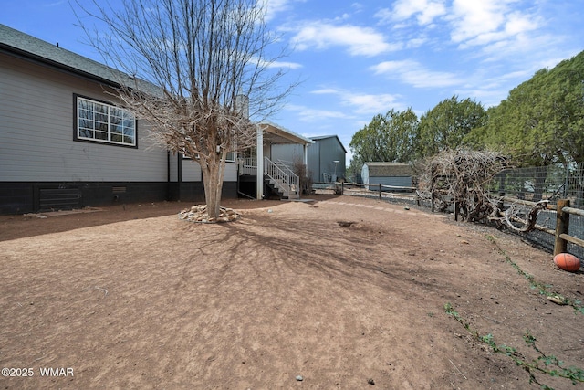 6668 Bandido Way, Show Low, AZ 85901 - view of yard with fence, central AC unit, and stairway