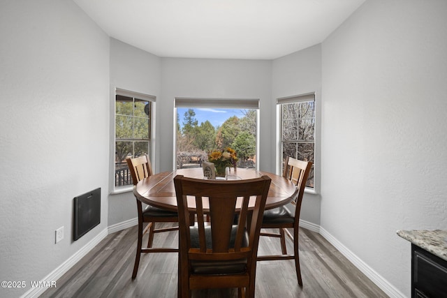 6668 Bandido Way, Show Low, AZ 85901 - dining room featuring baseboards, wood finished floors, and a wealth of natural light