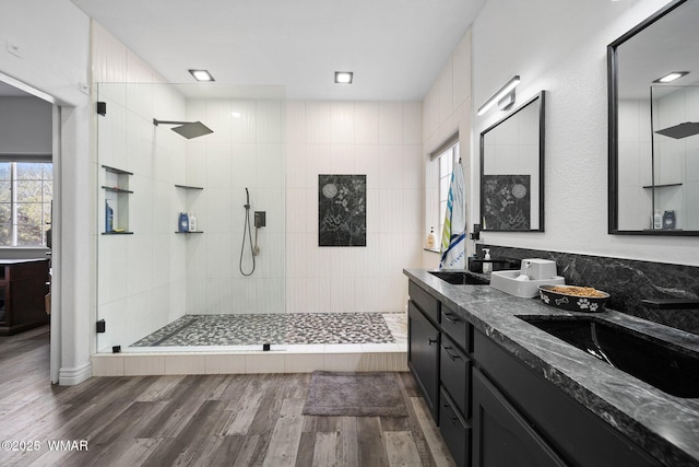 6668 Bandido Way, Show Low, AZ 85901 - full bathroom featuring a sink, walk in shower, and wood finished floors