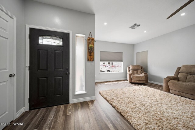 6668 Bandido Way, Show Low, AZ 85901 - foyer entrance featuring visible vents, baseboards, dark wood-type flooring, plenty of natural light, and a ceiling fan