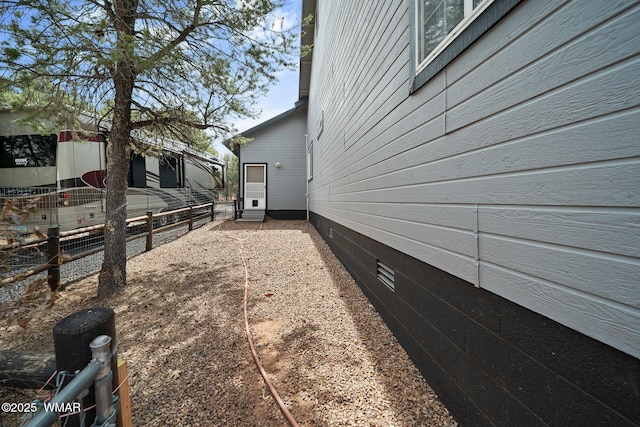 6668 Bandido Way, Show Low, AZ 85901 - view of property exterior with crawl space and fence