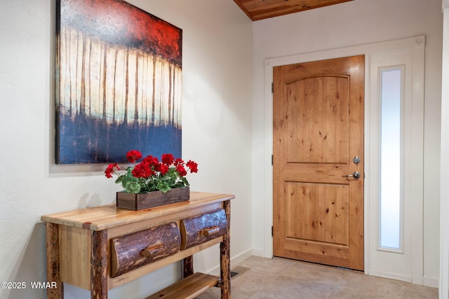 foyer entrance featuring baseboards