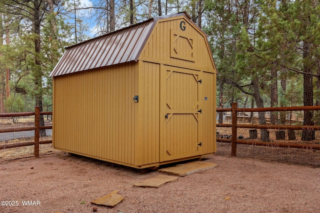 view of shed with fence