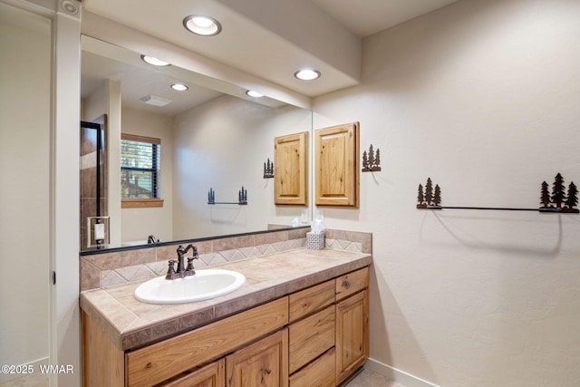 bathroom featuring recessed lighting, visible vents, vanity, and baseboards