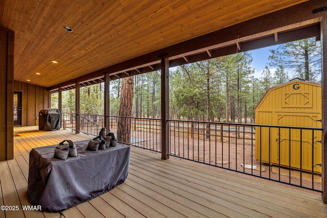 exterior space featuring an outbuilding, a shed, and area for grilling